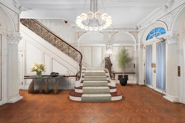 18 E 76th St, New York City, NY 10021 - common area with a decorative wall, stairway, and a towering ceiling