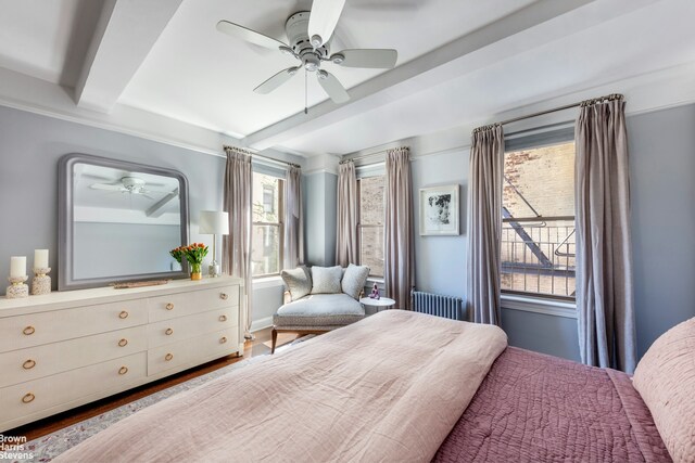 136 Waverly Pl Unit 5E, New York City, NY 10014 - bedroom with beam ceiling, ceiling fan, and radiator heating unit