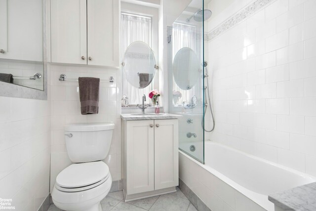 136 Waverly Pl Unit 5E, New York City, NY 10014 - bathroom with toilet, tiled shower / bath combo, and vanity