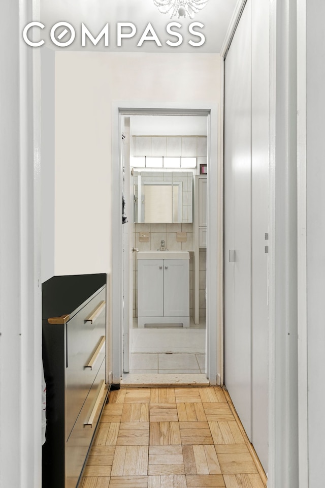 doorway to outside featuring a sink
