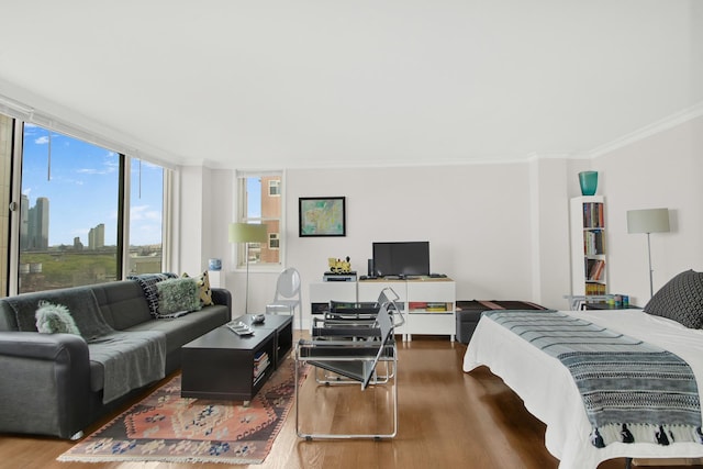 575 Main St Unit 1611, New York City, NY 10044 - bedroom featuring wood finished floors and crown molding