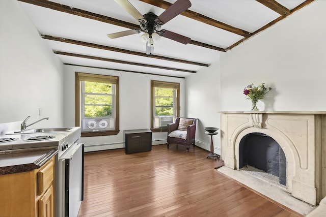 living room with a baseboard radiator, beamed ceiling, a high end fireplace, wood finished floors, and ceiling fan