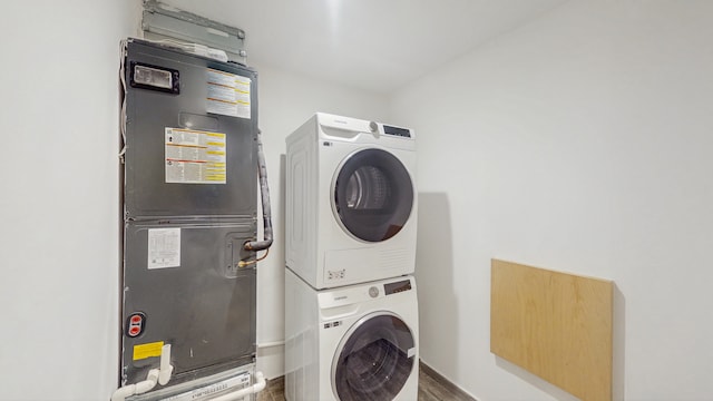 211 Jackson St Unit Garden2, New York City, NY 11211 - washroom with stacked washer / dryer, wood finished floors, and baseboards