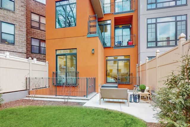 211 Jackson St Unit Garden2, New York City, NY 11211 - back of property featuring stucco siding and a patio