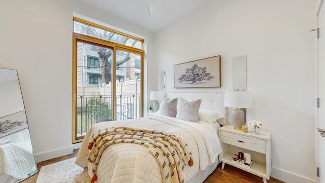 211 Jackson St Unit Garden2, New York City, NY 11211 - bedroom featuring access to outside, baseboards, and wood finished floors
