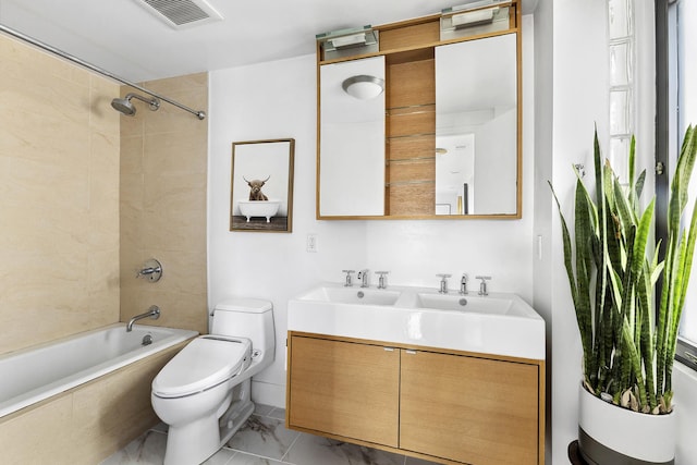 364 Manhattan Ave Unit 1-G, New York City, NY 11211 - bathroom featuring toilet, bathtub / shower combination, double vanity, and marble finish floors