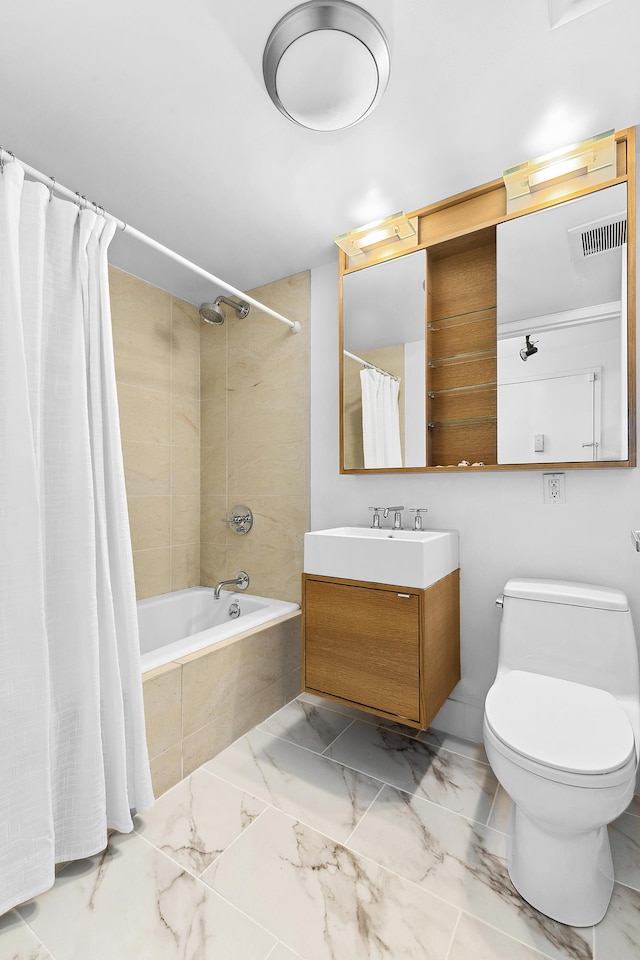 full bath with marble look tiles, vanity, toilet, and tiled shower / bath combo