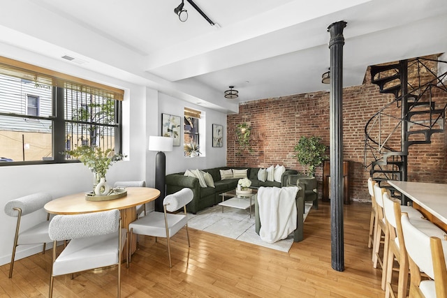 364 Manhattan Ave Unit 1-G, New York City, NY 11211 - living room with brick wall and light wood-type flooring