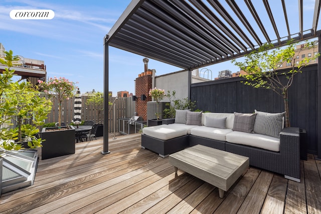 deck featuring an outdoor living space, fence, and outdoor dining area