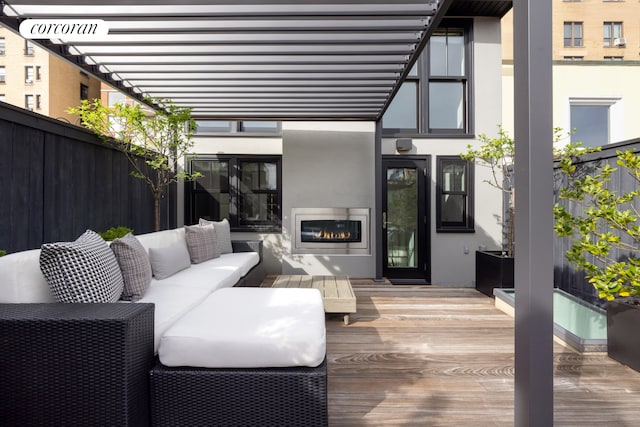 deck with an outdoor hangout area and fence
