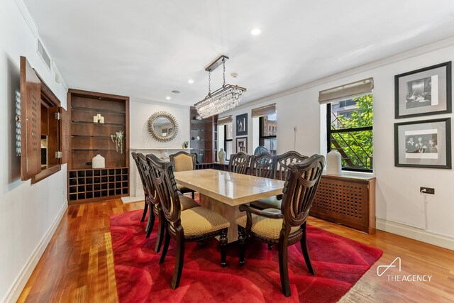197 E 76th St, New York City, NY 10021 - dining space featuring baseboards, wood finished floors, recessed lighting, and crown molding