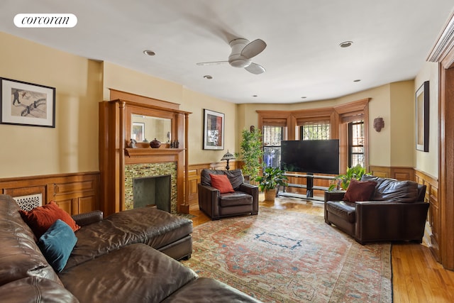 62 Rutland Rd, New York City, NY 11225 - living area with wainscoting, a fireplace, a ceiling fan, wood finished floors, and recessed lighting