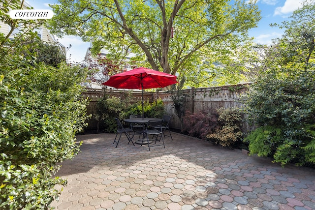62 Rutland Rd, New York City, NY 11225 - fenced backyard featuring a patio area and outdoor dining area