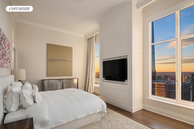 30 Park Pl Unit Ph77A, New York City, NY 10007 - bedroom featuring ornamental molding, wood finished floors, and baseboards
