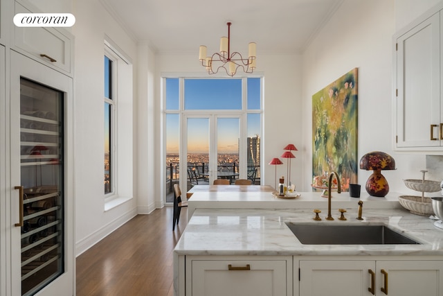 30 Park Pl Unit Ph77A, New York City, NY 10007 - kitchen with a sink, wine cooler, a chandelier, a peninsula, and wood finished floors