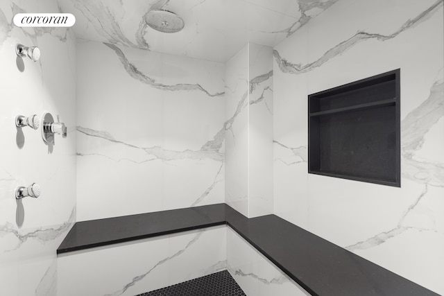 full bath with a marble finish shower