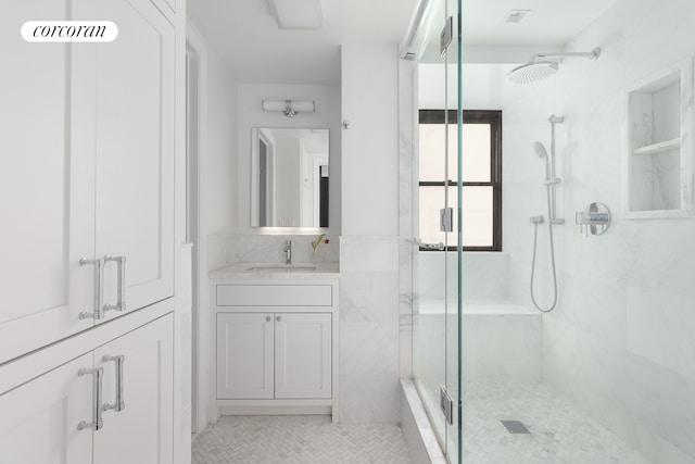 301 E 64th St Unit 7D, New York City, NY 10065 - bathroom with a stall shower, tile patterned floors, and vanity