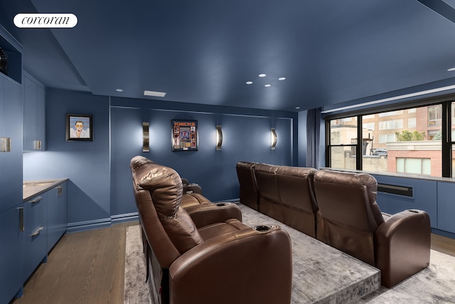 cinema room featuring wood finished floors and recessed lighting