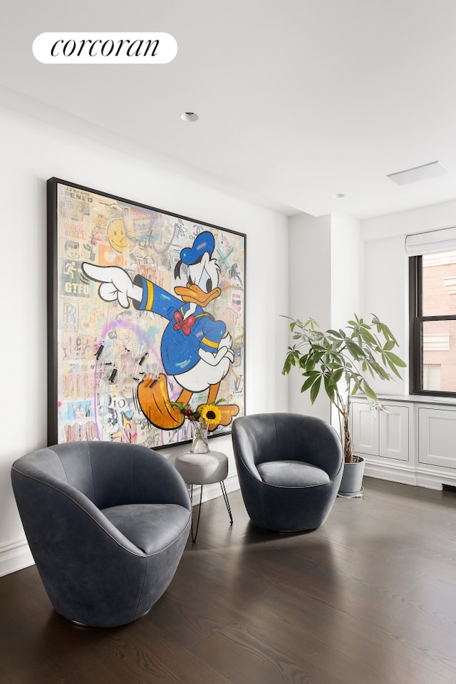 301 E 64th St Unit 7D, New York City, NY 10065 - living area featuring wood finished floors
