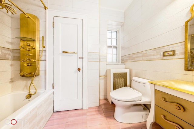 full bathroom featuring tile walls, toilet, radiator, tiled shower / bath, and tile patterned floors