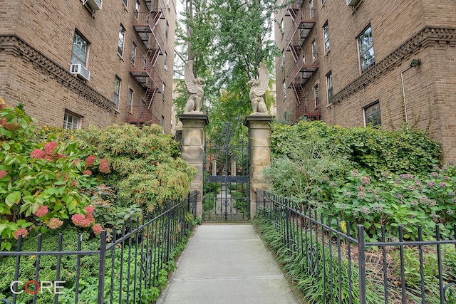 view of community with a gate and fence