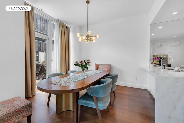 555 W 59th St Unit Th3C, New York City, NY 10019 - dining area with a chandelier, dark wood-style floors, baseboards, and recessed lighting