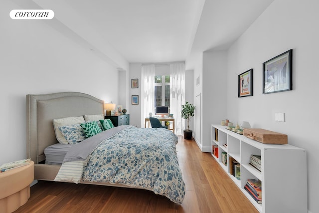 555 W 59th St Unit Th3C, New York City, NY 10019 - bedroom featuring wood finished floors and access to outside