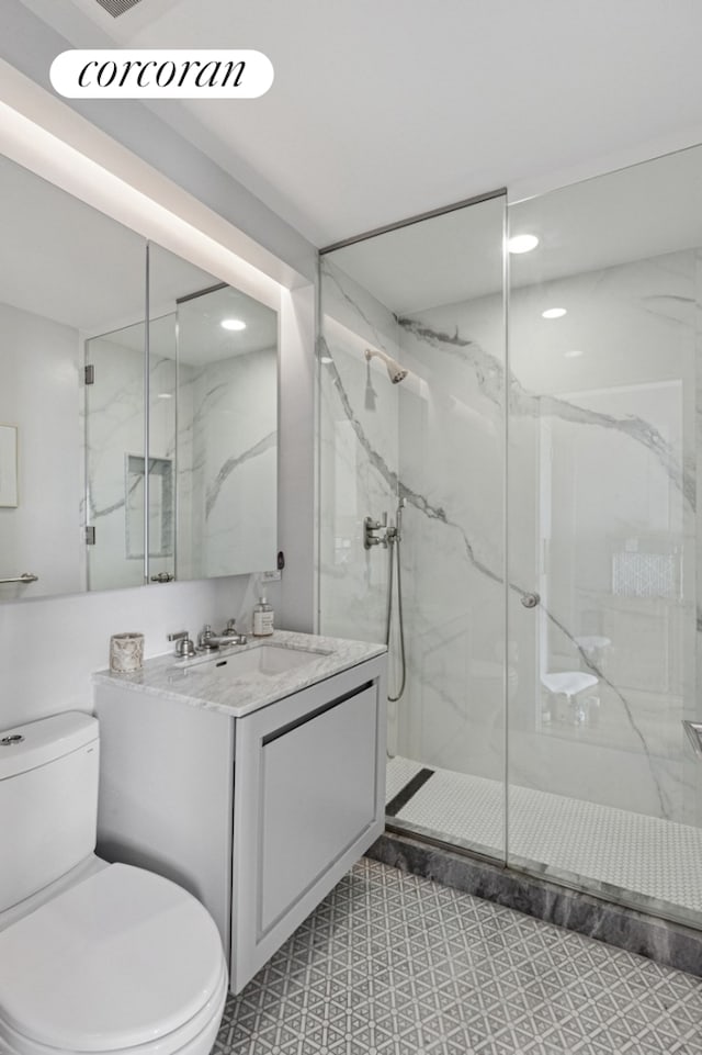 2 River Ter Unit 23C, New York City, NY 10282 - full bath featuring a marble finish shower, vanity, and recessed lighting