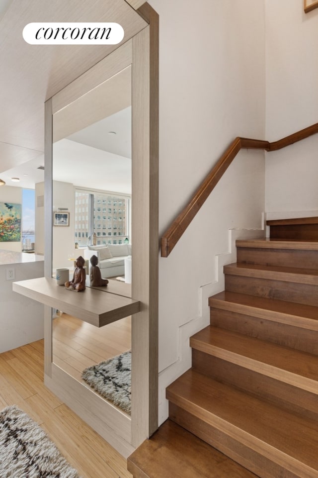 2 River Ter Unit 23C, New York City, NY 10282 - stairs with wood finished floors and healthy amount of natural light