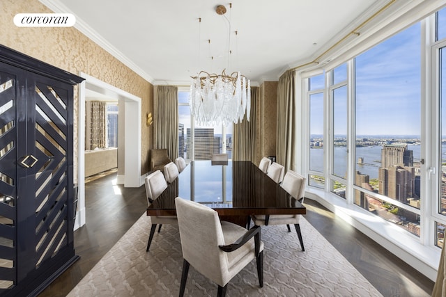 30 Park Pl Unit 68A, New York City, NY 10007 - dining area with a water view, crown molding, wallpapered walls, and a chandelier
