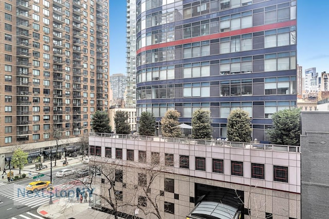 view of building exterior featuring a view of city