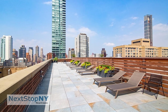 view of patio featuring a skyline view