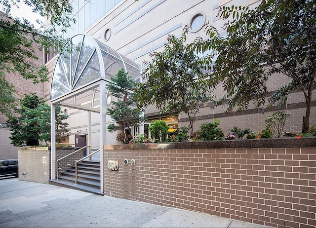 200 E 89th St Unit 27D, New York City, NY 10128 - view of building exterior with fence