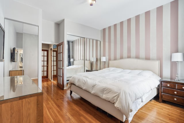 341 W 47th St Unit 4R, New York City, NY 10036 - bedroom with light wood-style floors