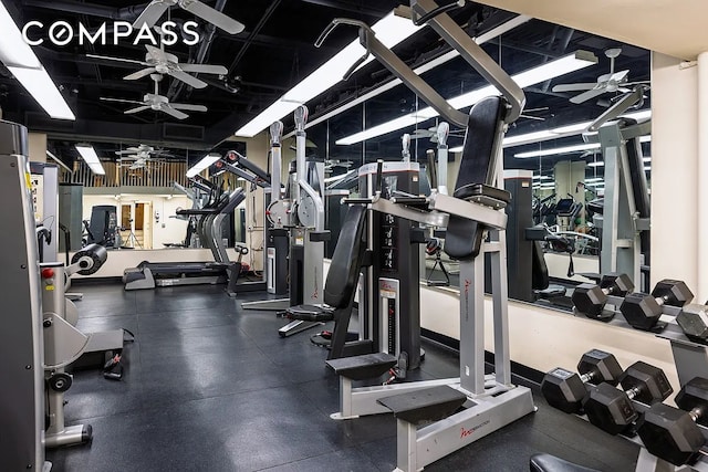 exercise room with ceiling fan