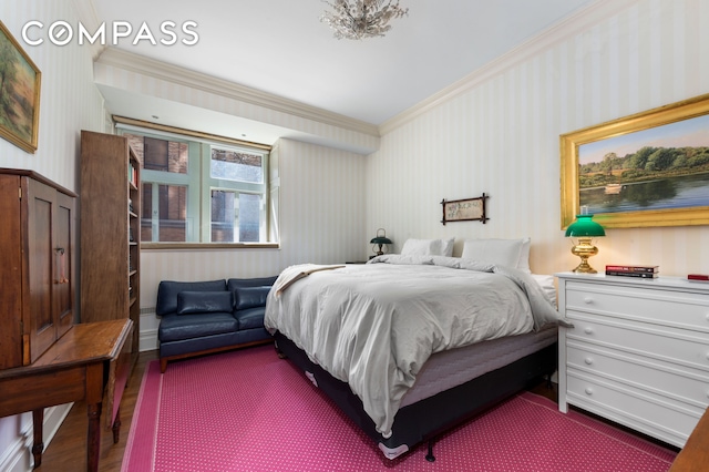 bedroom with crown molding, dark wood-style flooring, and wallpapered walls