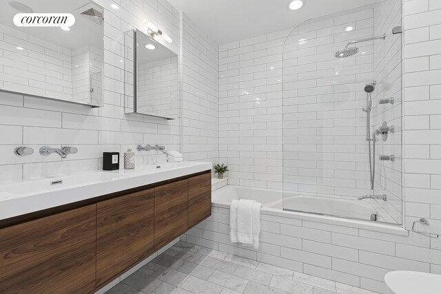 46 Lispenard St Ph, Ph, New York City, NY 10013 - full bath featuring tiled shower / bath, double vanity, toilet, decorative backsplash, and tile walls