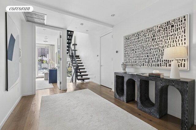 46 Lispenard St Ph, Ph, New York City, NY 10013 - laundry room with wood finished floors and baseboards