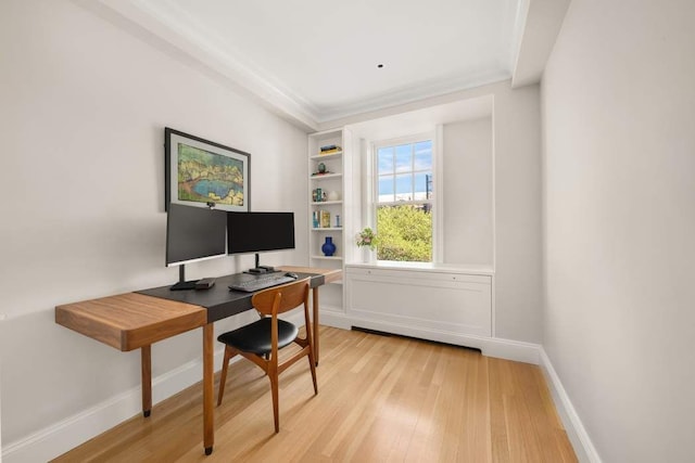 40 W 77th St Unit 7B, New York City, NY 10024 - home office featuring light wood finished floors, built in shelves, baseboards, and ornamental molding