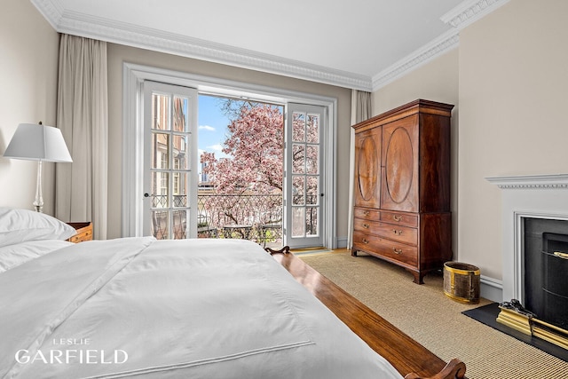 15 Sutton Place, New York City, NY 10022 - bedroom with access to exterior, crown molding, wood finished floors, and a fireplace with flush hearth
