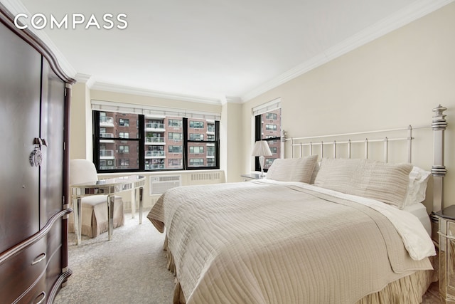 bedroom featuring crown molding and carpet flooring