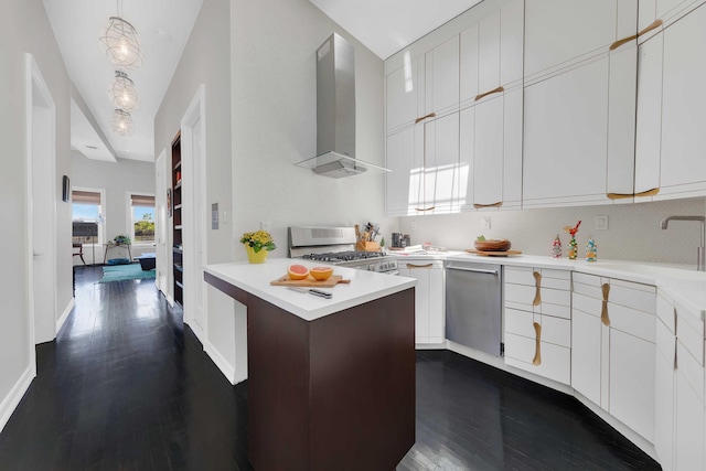 kitchen featuring wall chimney exhaust hood, dishwasher, range with gas cooktop, a sink, and light countertops