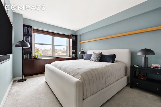 360 W 22nd St Unit 12B, New York City, NY 10011 - carpeted bedroom featuring baseboards