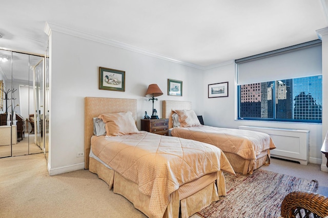 bedroom featuring light colored carpet, crown molding, and baseboards