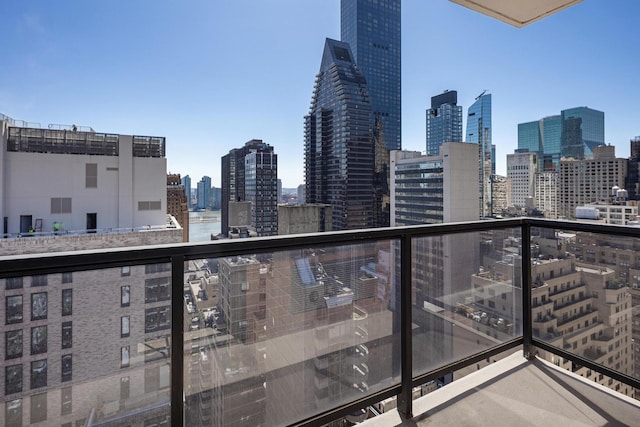 balcony featuring a skyline view