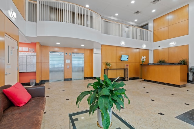 reception featuring a towering ceiling
