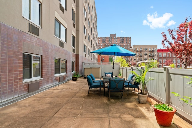 view of patio / terrace featuring outdoor dining space and a fenced backyard