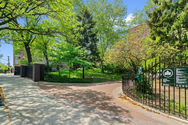 surrounding community featuring fence and a gate
