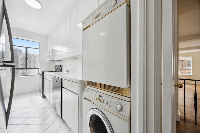laundry room with stacked washer and clothes dryer