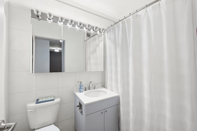 99 John St Unit 205, New York City, NY 10038 - bathroom with tile walls, toilet, and vanity